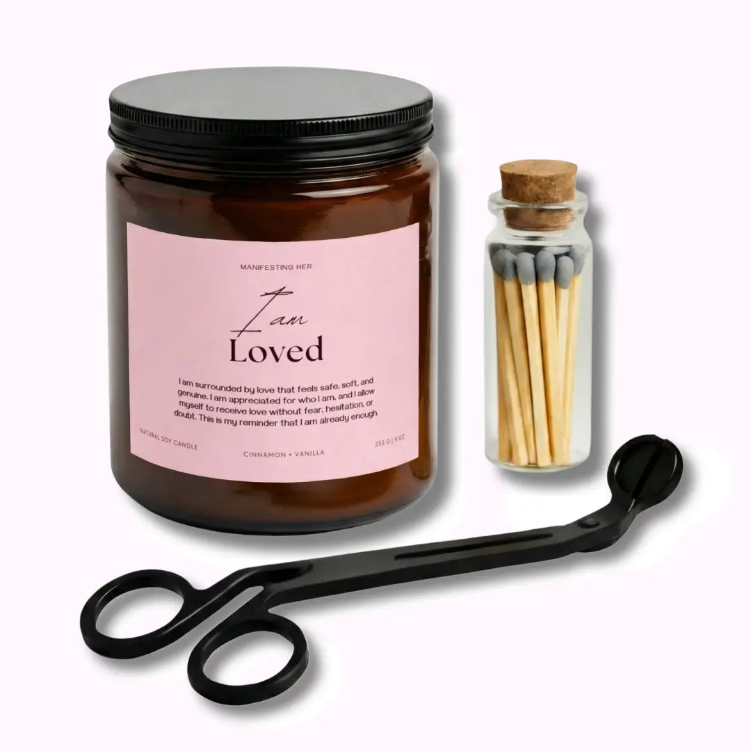 Candle jar with pink label, matches in a bottle, and black scissors on a white background
